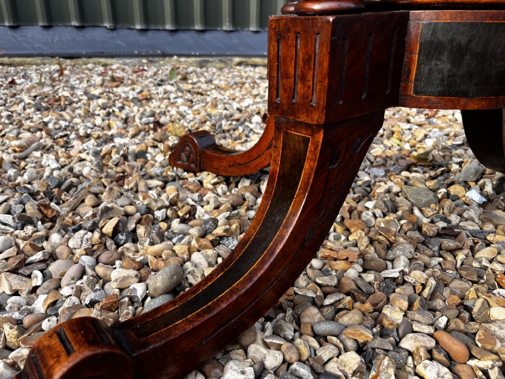 An octagonal Victorian burr walnut low coffee table with central floral marquetry inlay and splayed legs. View III