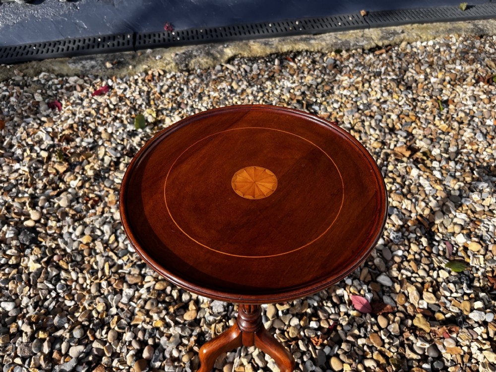 A pair of Edwardian mahogany wine tables featuring circular inlaid tops, turned stems, and tripod legs. View II