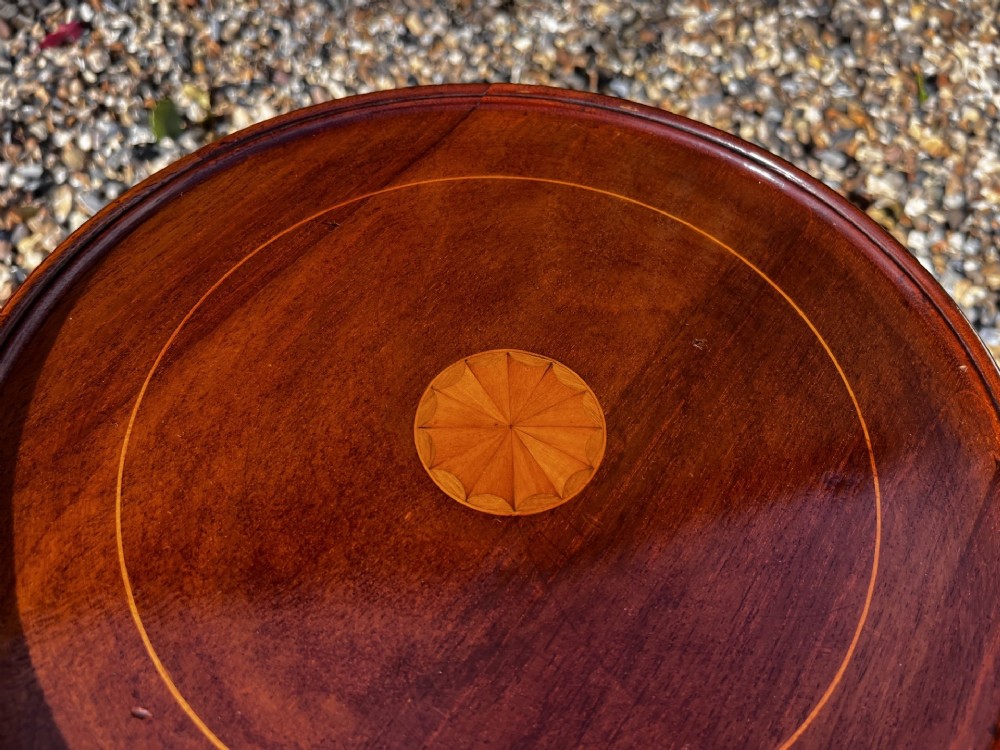 A pair of Edwardian mahogany wine tables featuring circular inlaid tops, turned stems, and tripod legs. View III