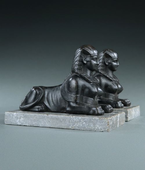 PAIR OF EGYPTIAN REVIVAL CAST IRON SPHINXES