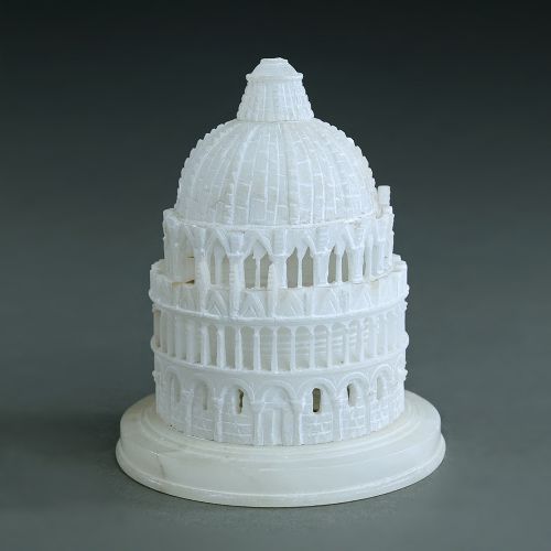 A carved off-white alabaster architectural model depicting the Baptistery of Pisa resting on a circular stepped marble base.