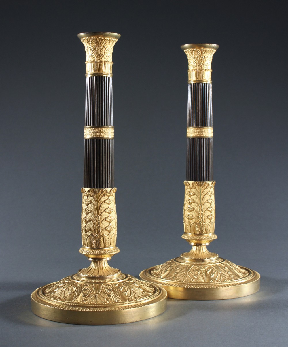 Pair of patinated and gilt bronze reeded column candlesticks View II