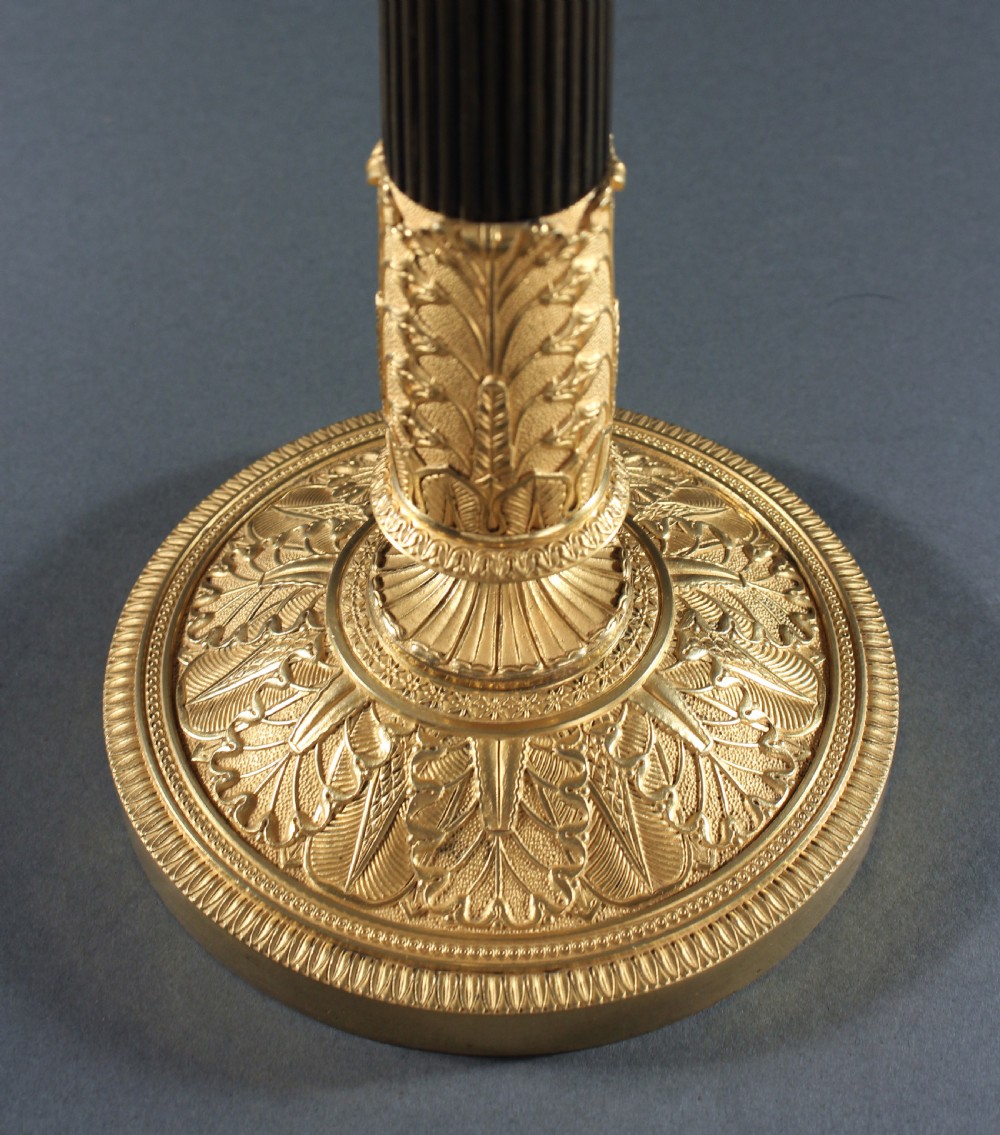 Pair of patinated and gilt bronze reeded column candlesticks View III