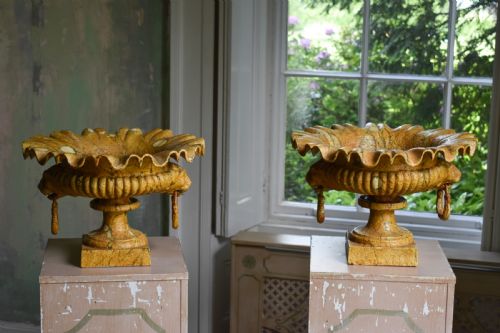 PAIR OF PAINTED CAST IRON URNS