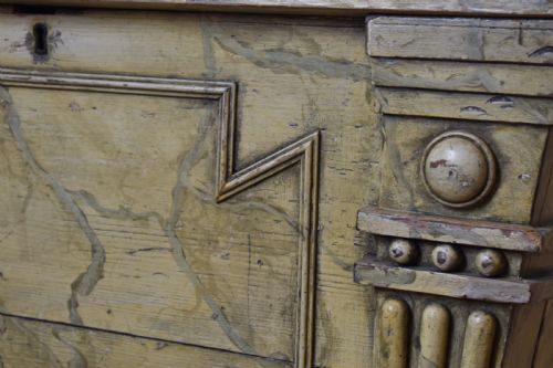 fig 2. A Regency sarcophagus-form cellaret decorated with faux marble painted timber, fluted corner columns, and carved lion paw feet.