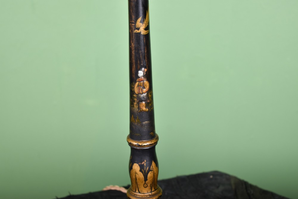 A black lacquered turned column table lamp with hand-painted gilt Chinoiserie decoration and a pleated burgundy fabric shade. View III
