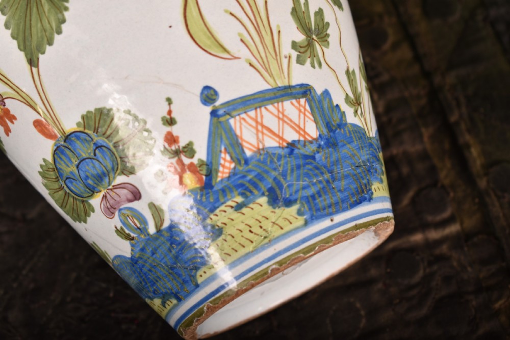 A white tin-glazed earthenware vase featuring hand-painted polychrome Garofano carnation motifs in orange, green, blue, and purple. View VI