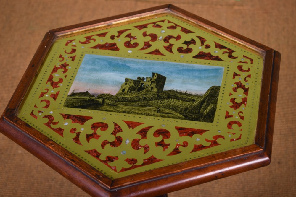 A William IV mahogany side table with a painted hexagonal top, spiral-carved central column, and a triform scroll-foot base. View IV