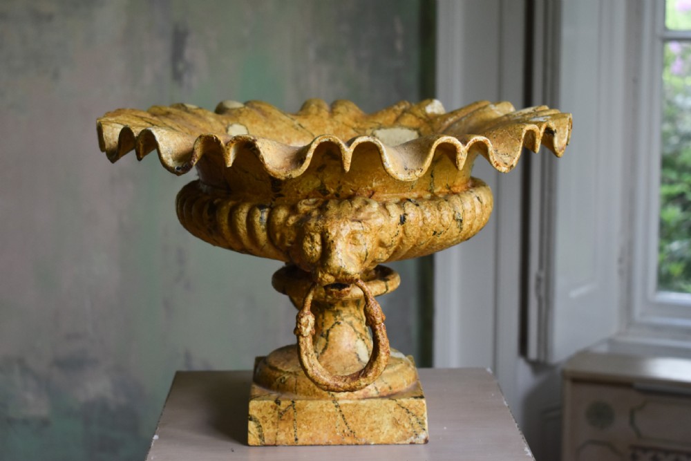 A pair of yellow painted cast iron urns with scalloped rims, gadrooned bodies, and square pedestal bases. View III
