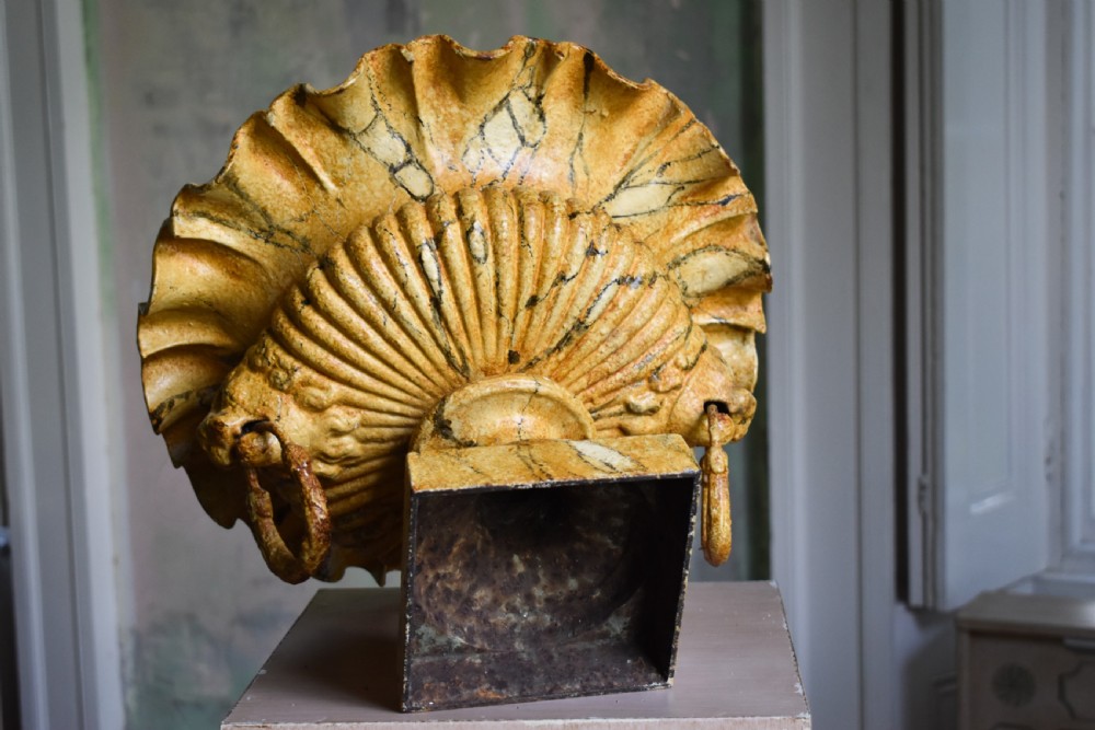 A pair of yellow painted cast iron urns with scalloped rims, gadrooned bodies, and square pedestal bases. View IV