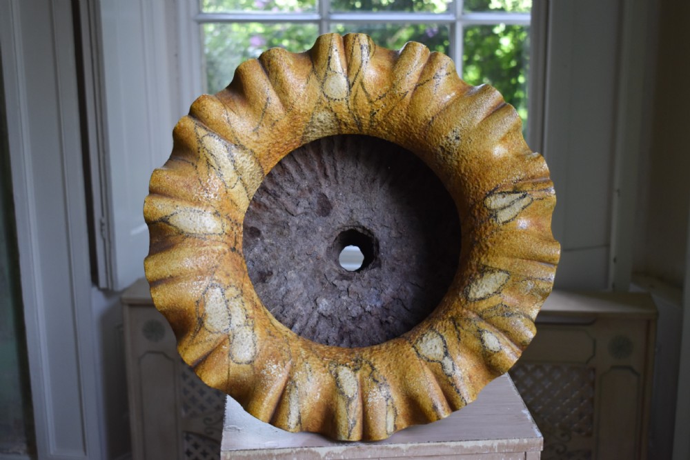 A pair of yellow painted cast iron urns with scalloped rims, gadrooned bodies, and square pedestal bases. View V