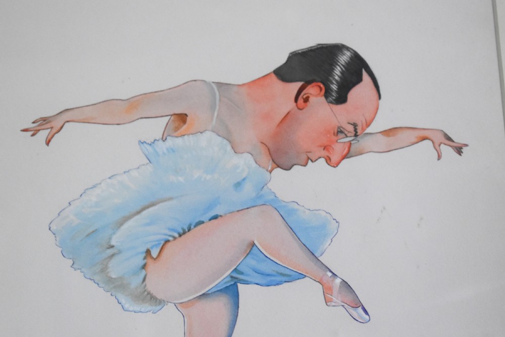 A framed original watercolour illustration depicting a humorous male figure in a light blue ballet tutu and pointe shoes performing a pose. View II