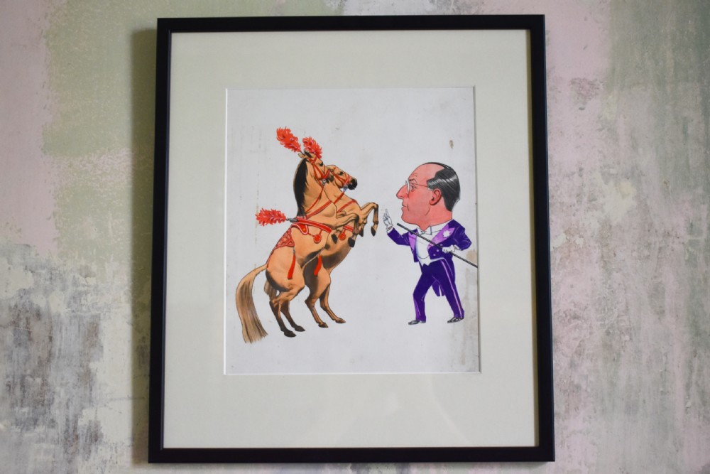 A framed watercolour caricature depicting a man in a purple tuxedo facing two rearing horses adorned with red plumes.