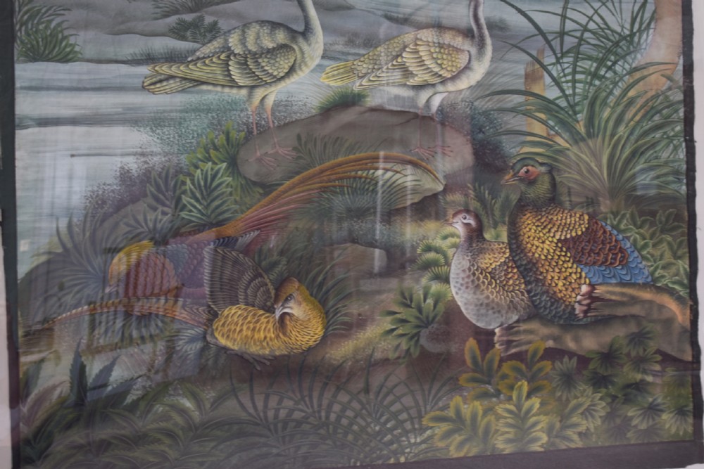 A large nineteenth-century framed Asian wall hanging painted with birds, blooming flowers, and foliage on a muted green background. View IX