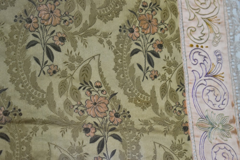 A large square framed Victorian silk patchwork panel featuring octagonal segments with intricate embroidered floral motifs and a dated section in the corner. View IX