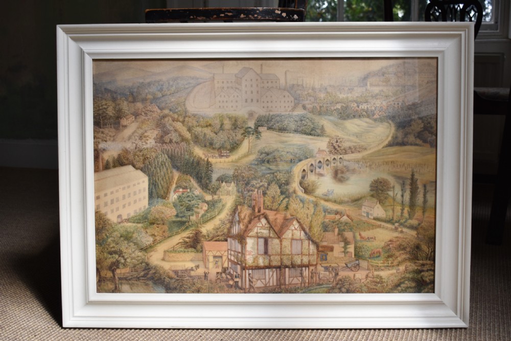 A framed watercolour painting featuring a detailed rural landscape with a brewery, timber-framed building, stone bridge, and rolling green hills.