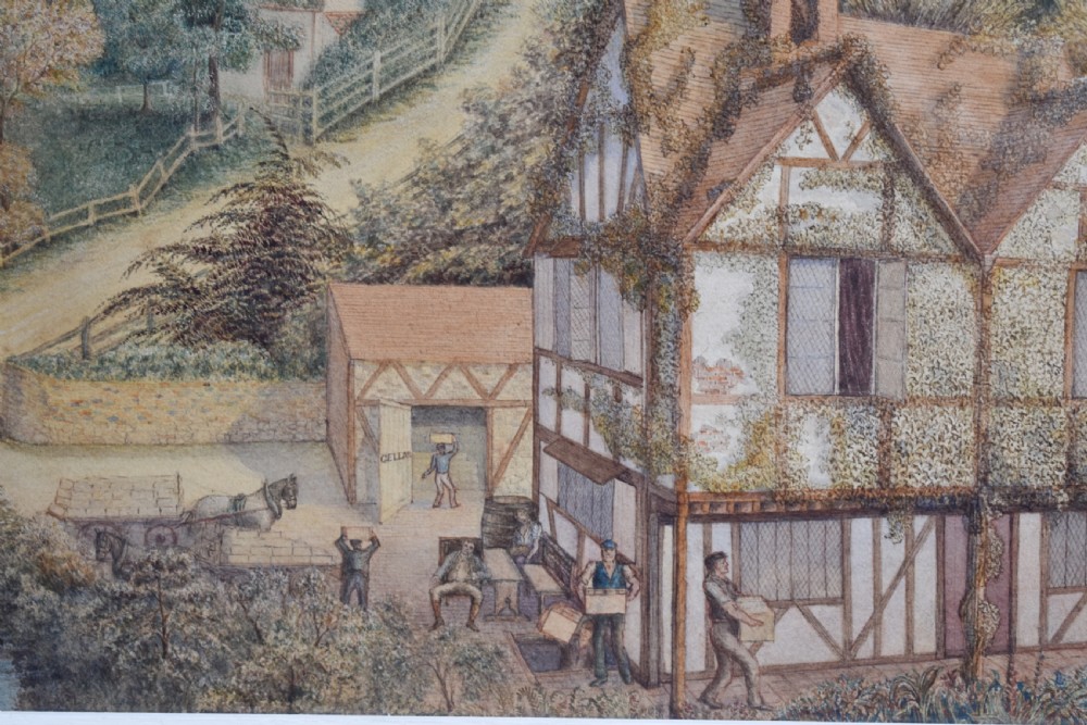 A framed watercolour painting featuring a detailed rural landscape with a brewery, timber-framed building, stone bridge, and rolling green hills. View V