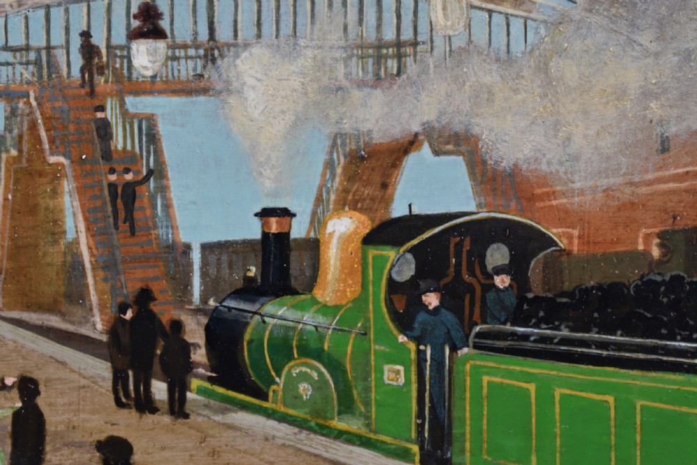 An oil painting on board depicting a busy Victorian steam train station scene inside a heavy bobbin-turned wood frame. View II
