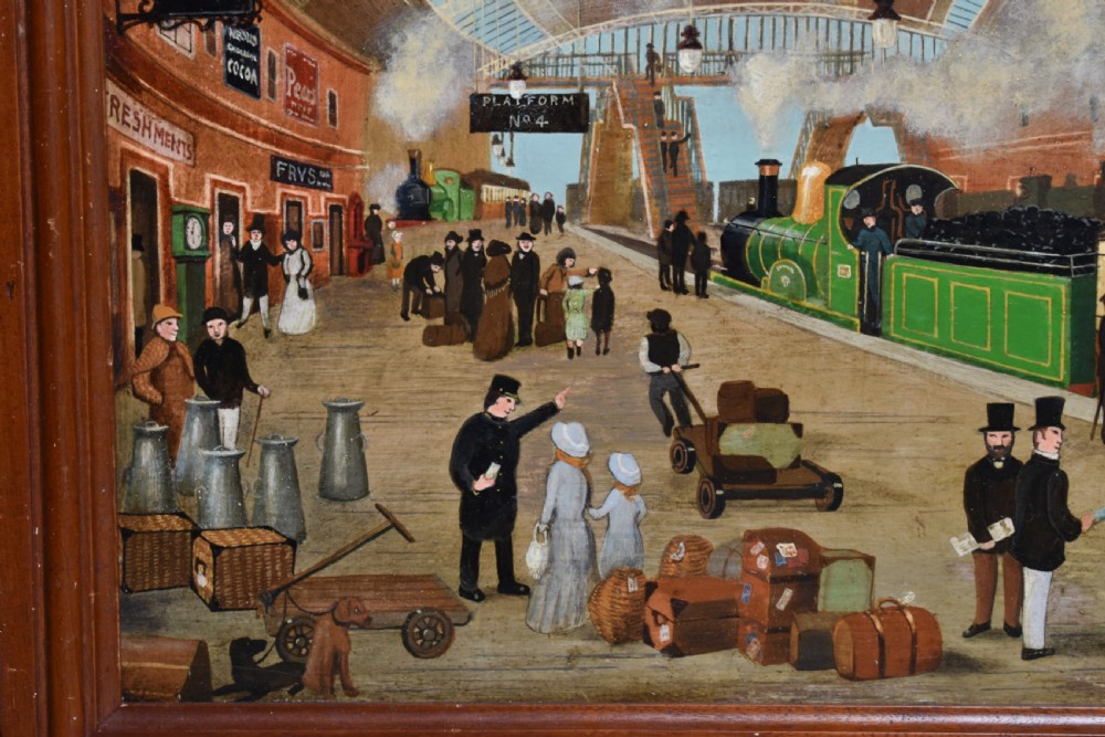 An oil painting on board depicting a busy Victorian steam train station scene inside a heavy bobbin-turned wood frame. View IV