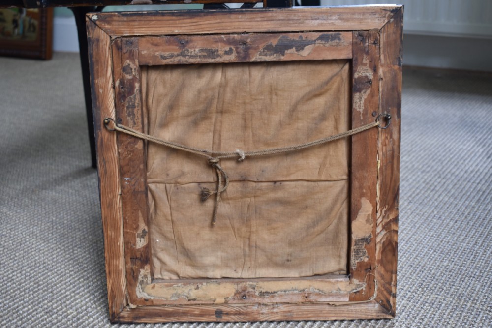 A framed 1844 Victorian needlework sampler featuring an embroidered bird perched on stylized floral stems with hearts and lettering, set in a dark wood frame. View V