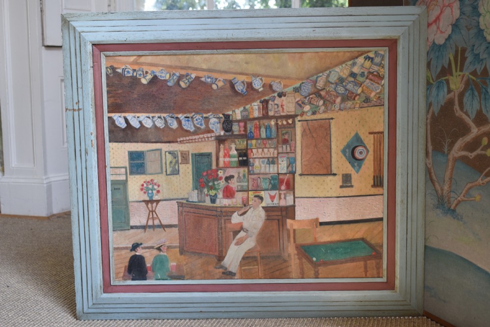 A framed oil on canvas painting depicting a detailed tavern bar interior scene with seated figures, tankards hanging overhead, and a painted pale blue wooden frame.