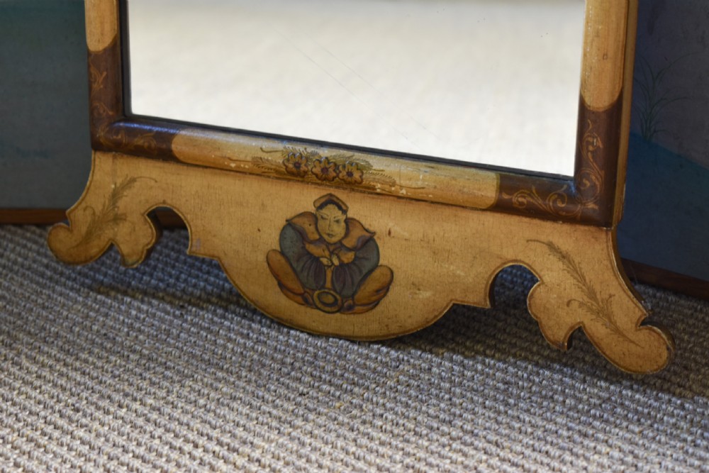 A tall, narrow Queen Anne style mirror featuring an arched frame decorated with chinoiserie hand-painted scenes, a carved gilt shell cresting, and ochre yellow lacquered borders. View III