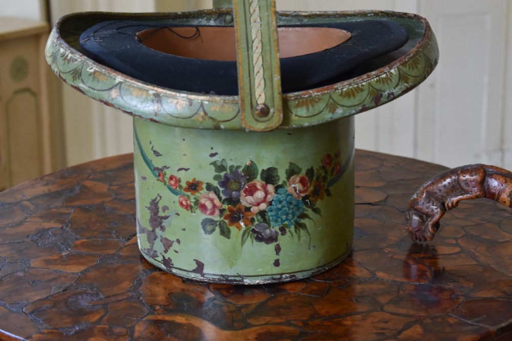 A Georgian sage green painted leather hat box featuring hand-painted floral bouquets, a wide flared rim with decorative borders, and a fixed arched carrying handle. View II