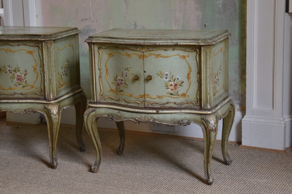 A pair of sage green French painted bedside cabinets with floral hand-painting, gilt scroll mouldings, double doors, and cabriole legs. View II