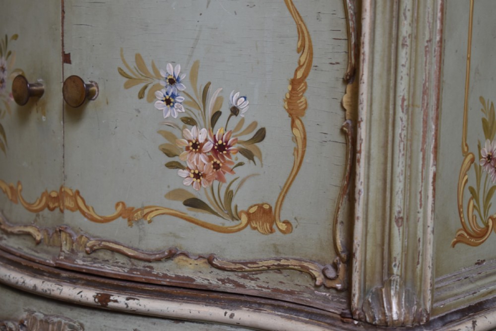 A pair of sage green French painted bedside cabinets with floral hand-painting, gilt scroll mouldings, double doors, and cabriole legs. View IV