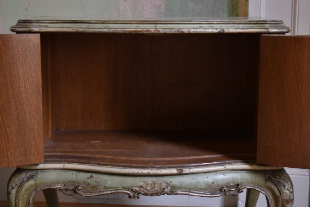 A pair of sage green French painted bedside cabinets with floral hand-painting, gilt scroll mouldings, double doors, and cabriole legs. View VI