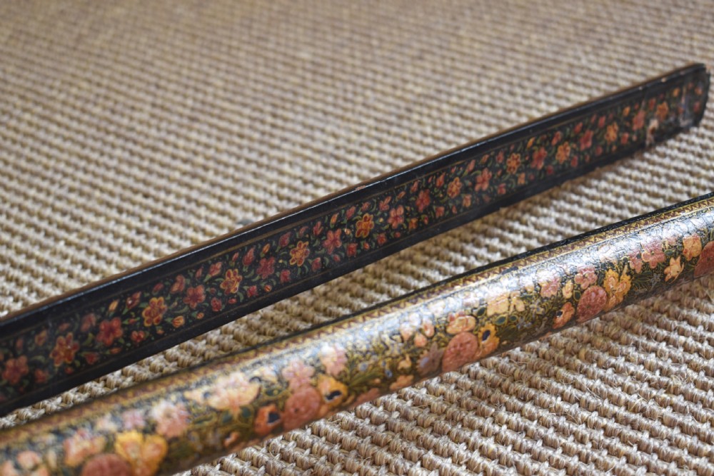 A long-handled Kashmiri fire bellows decorated with hand-painted floral lacquered motifs and a metal nozzle. View V