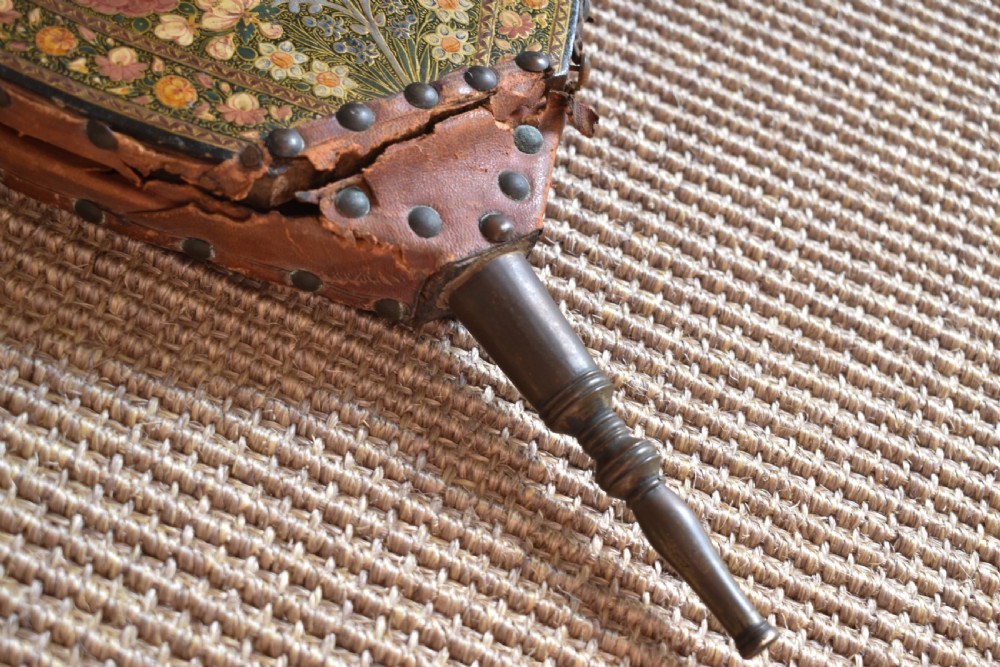 A long-handled Kashmiri fire bellows decorated with hand-painted floral lacquered motifs and a metal nozzle. View VI