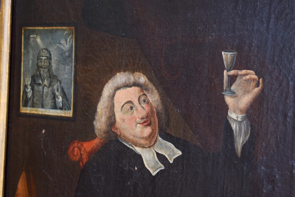 An eighteenth-century oil painting depicting a clergyman seated at a draped table with a punch bowl and glass, encased in a dark wooden frame with a gilded inner slip. View III