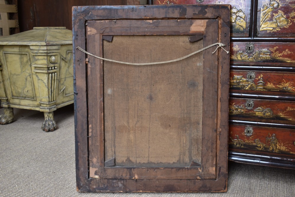 An eighteenth-century oil painting depicting a clergyman seated at a draped table with a punch bowl and glass, encased in a dark wooden frame with a gilded inner slip. View VII