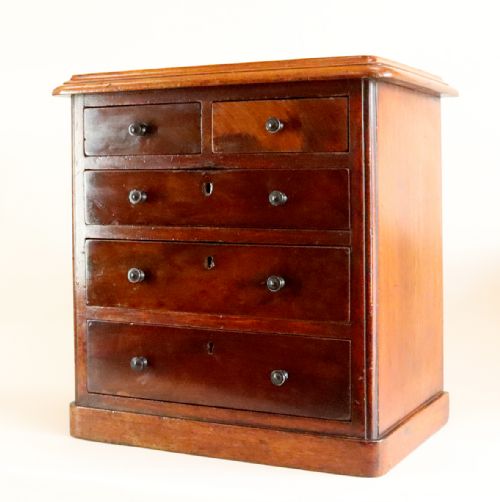 A MINIATURE 19TH CENTURY CHEST OF DRAWERS - ADDITIONAL PHOTO 1