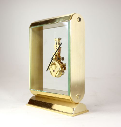 A MIDCENTURY SWISS INLINE SKELETON TIMEPIECE - ADDITIONAL PHOTO 1