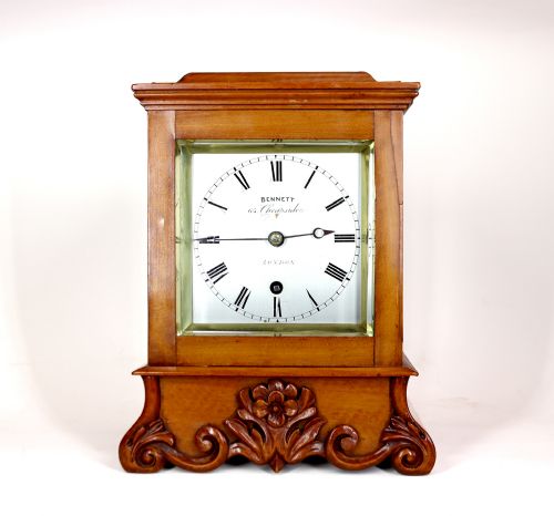 A VERY SMALL SATINWOOD LIBRARY CLOCK BY SIR JOHN BENNETT