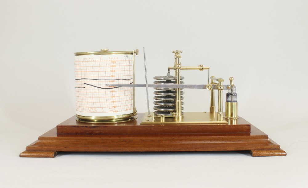 An antique five-glass barograph in a mahogany frame, featuring a brass drum chart mechanism, metal aneroid capsule stack, and glass ink bottle. View V