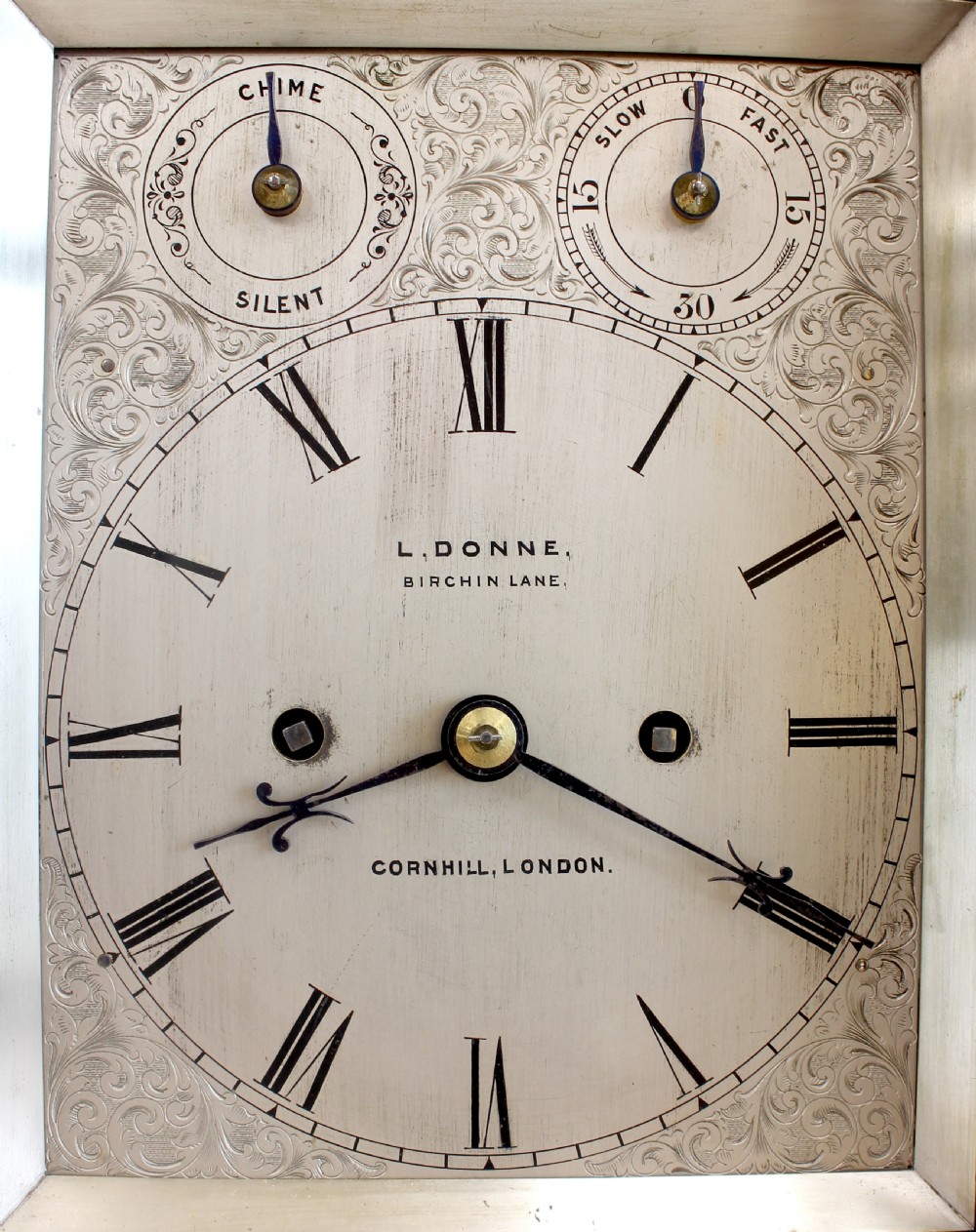 An antique rosewood architectural bracket clock featuring a pediment roof with a carved shell motif, fluted columns, and an engraved silvered dial with Roman numerals. View VI