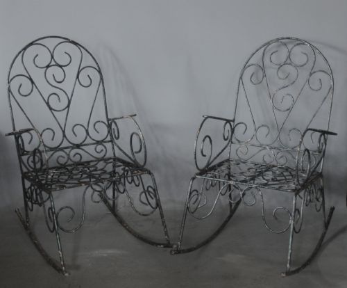 A PAIR OF WROUGHT IRON GARDEN ROCKING CHAIRS