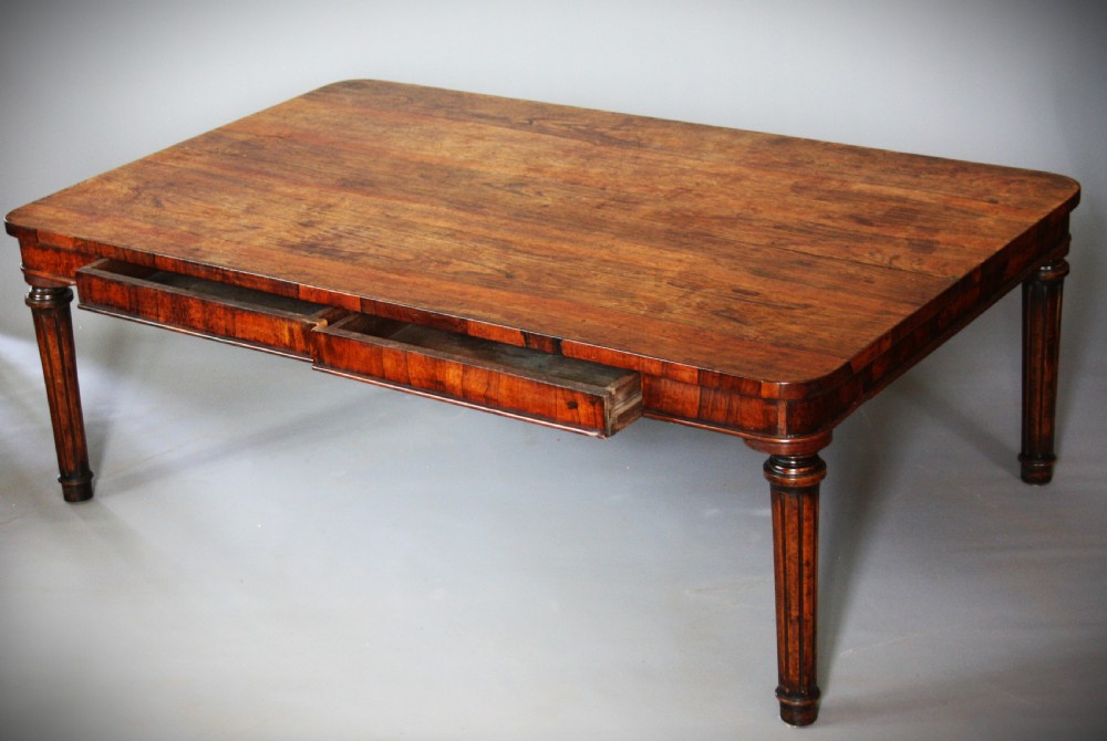 A low rectangular rosewood coffee table featuring rounded corners, a veneered apron, and fluted legs. View II