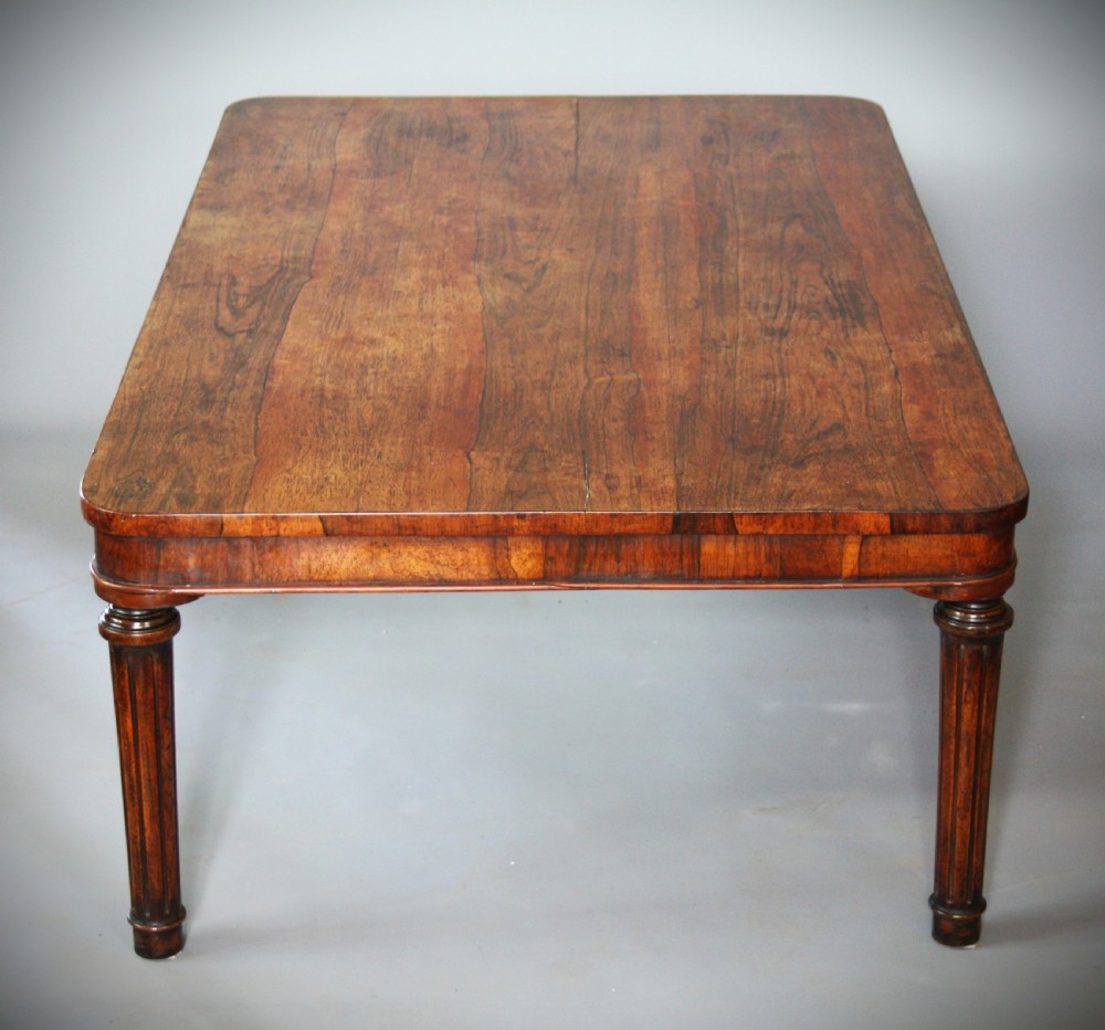 A low rectangular rosewood coffee table featuring rounded corners, a veneered apron, and fluted legs. View IV