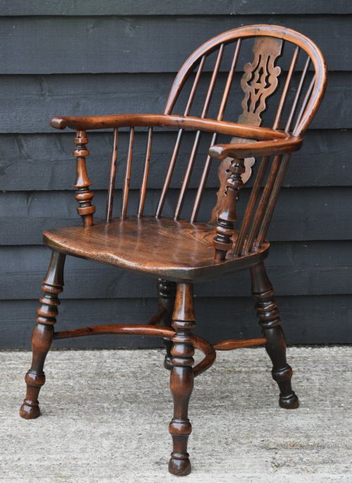 fig 2. A matched pair of 18th-century Georgian Windsor armchairs crafted from warm brown yew and elm with hooped backs and turned legs.