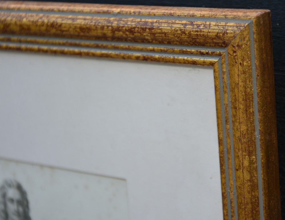 A framed 19th-century monochrome portrait engraving depicting a full-length statue of John Hampden set within a cream mount and a slim gold-leaf wooden frame. View IV