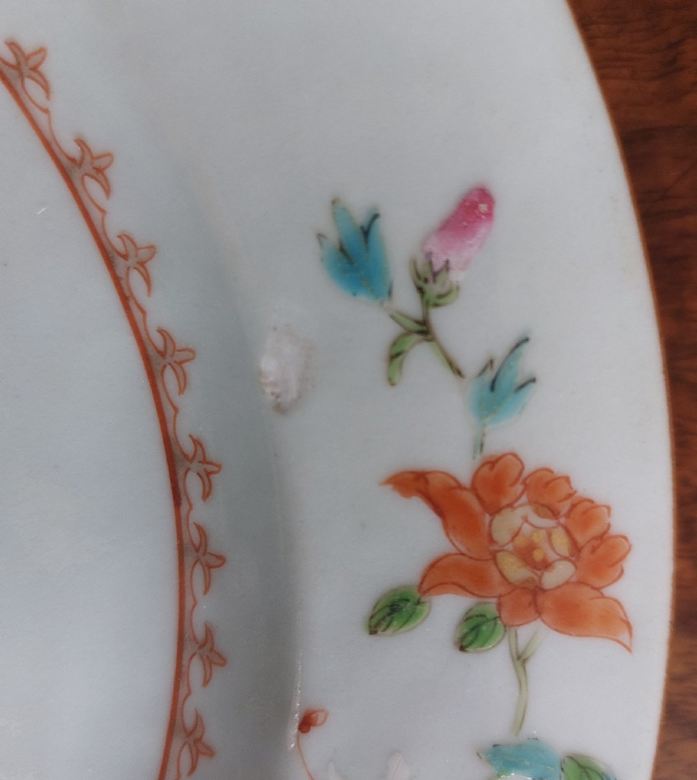 An 18th-century Chinese Qianlong period Famille Rose porcelain plate decorated with hand-painted polychrome floral motifs and rockwork. View III