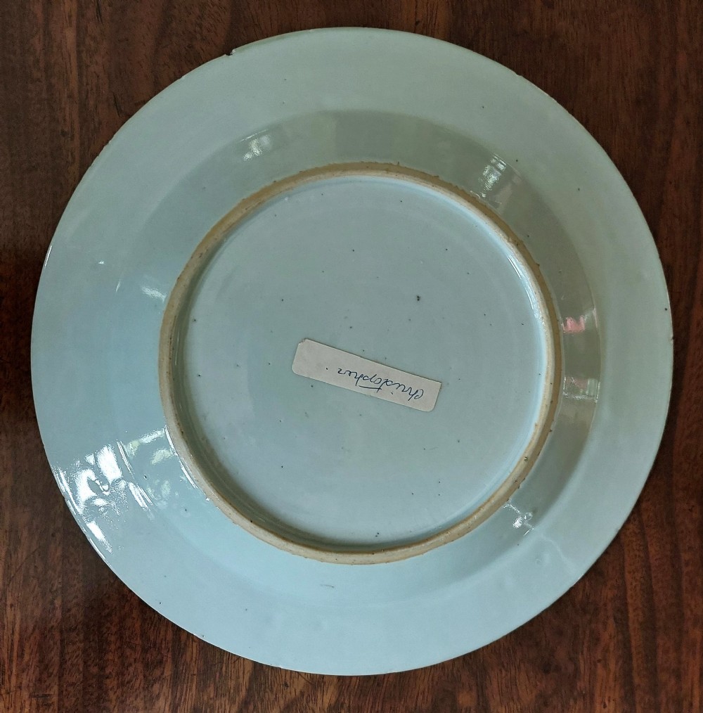 An 18th-century Chinese Qianlong period Famille Rose porcelain plate decorated with hand-painted polychrome floral motifs and rockwork. View IV