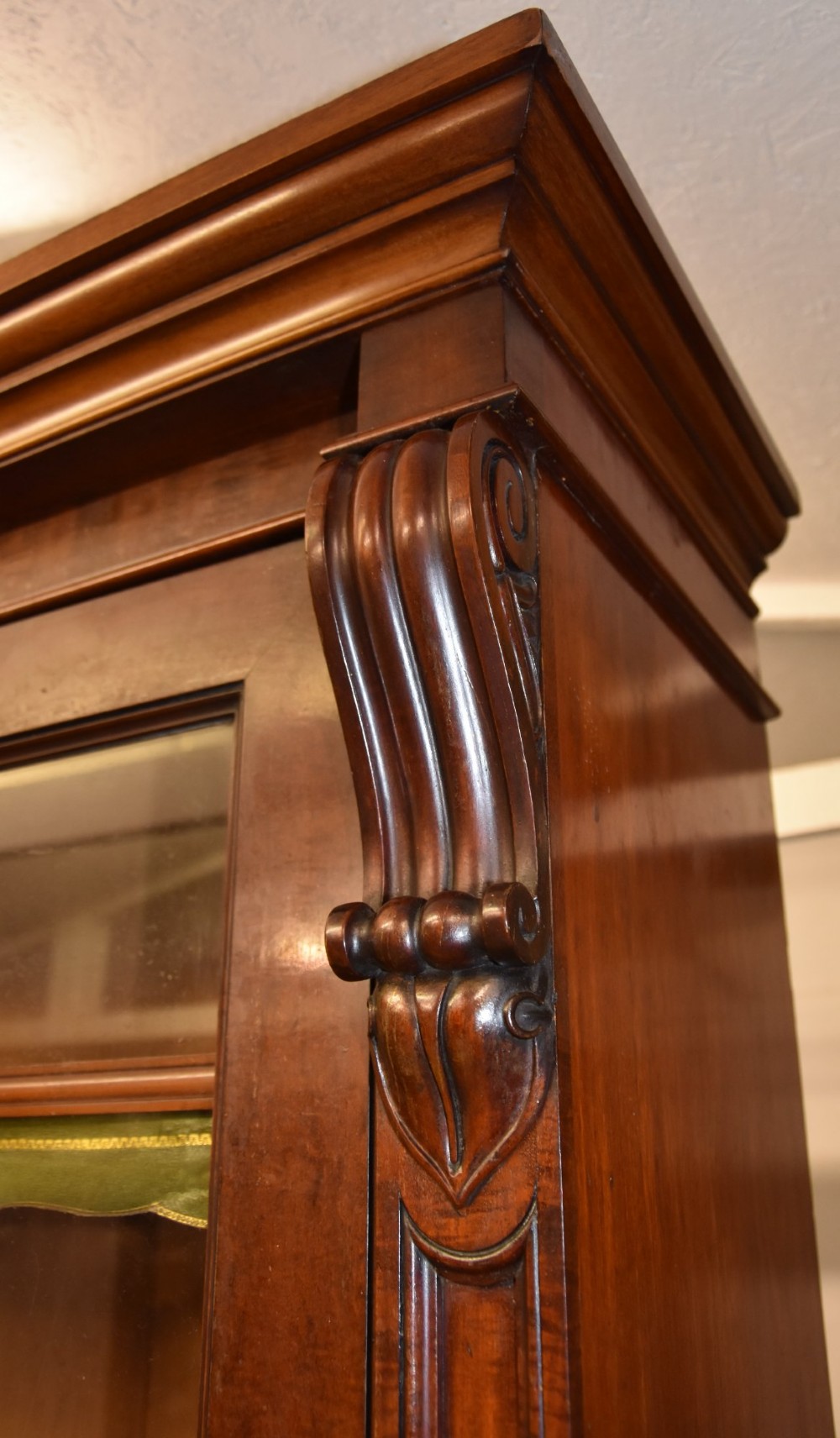 A large William IV mahogany triple bookcase cabinet featuring four upper glazed doors and three lower solid panelled doors. View VI
