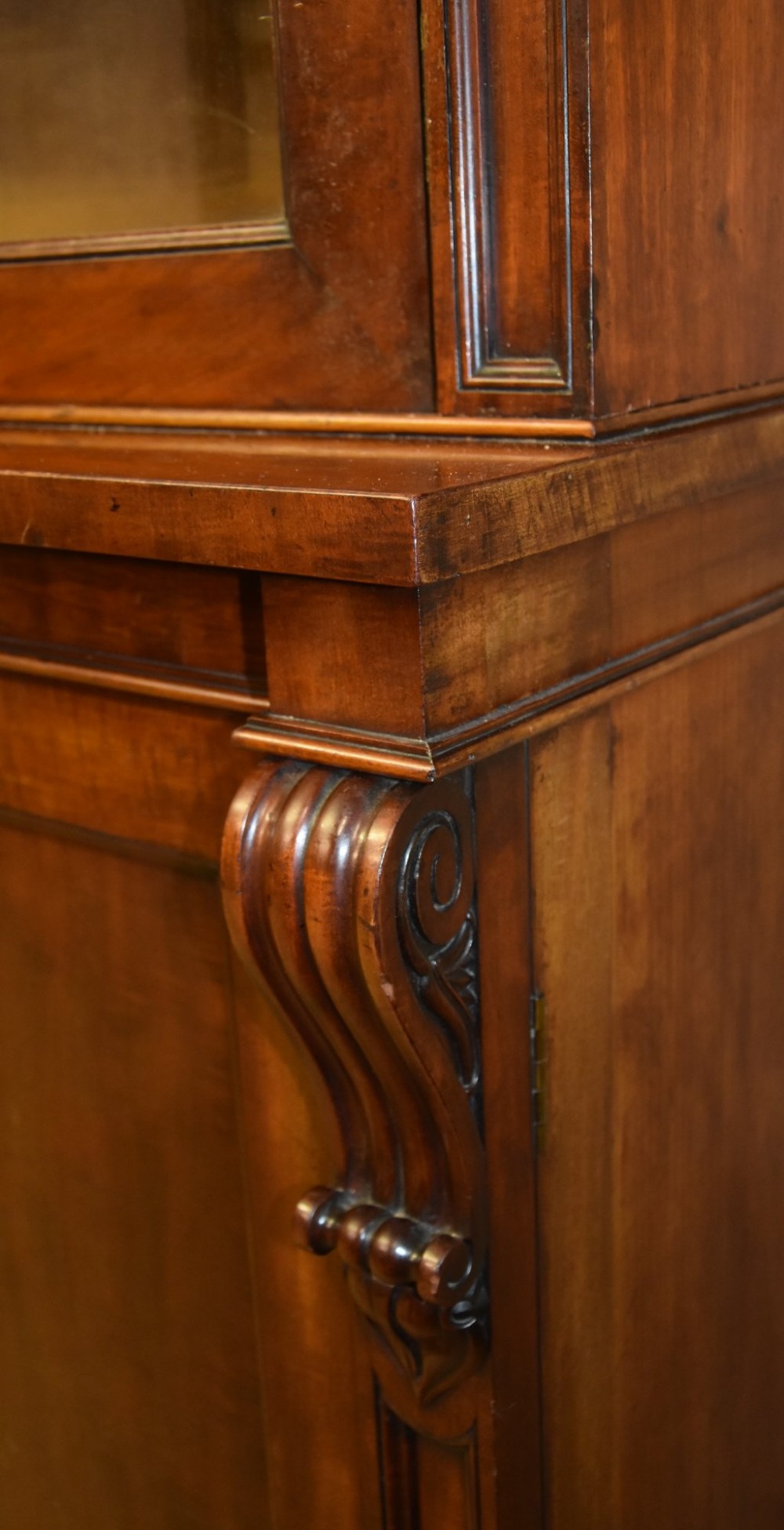 A large William IV mahogany triple bookcase cabinet featuring four upper glazed doors and three lower solid panelled doors. View VIII