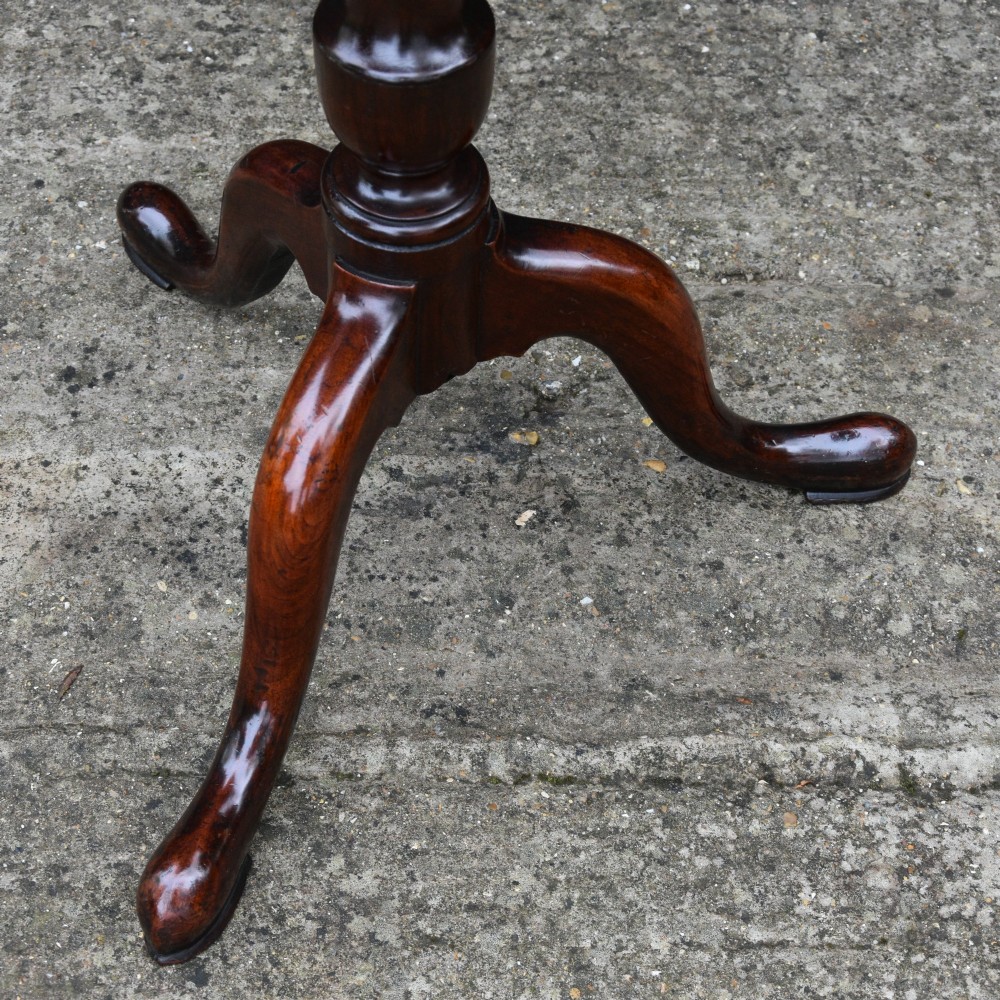 A 19th-century fruitwood tilt-top wine table with a rectangular rounded top, a turned column pedestal, and a tripod base. View IV