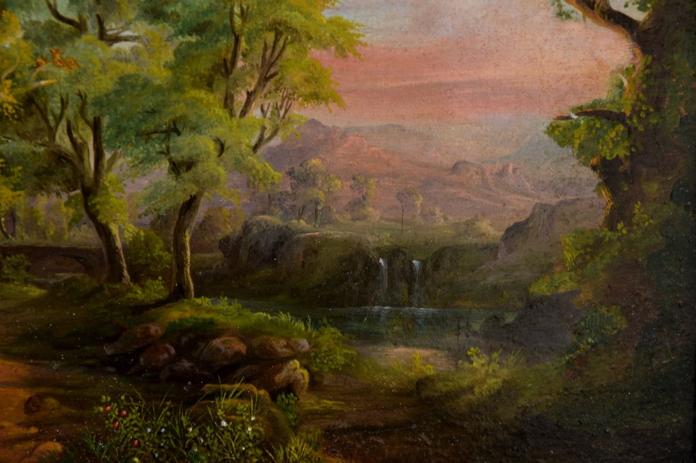 A 19th-century oil painting on board depicting a leafy woodland landscape with a path and distant hills, housed within a moulded gilt frame. View V
